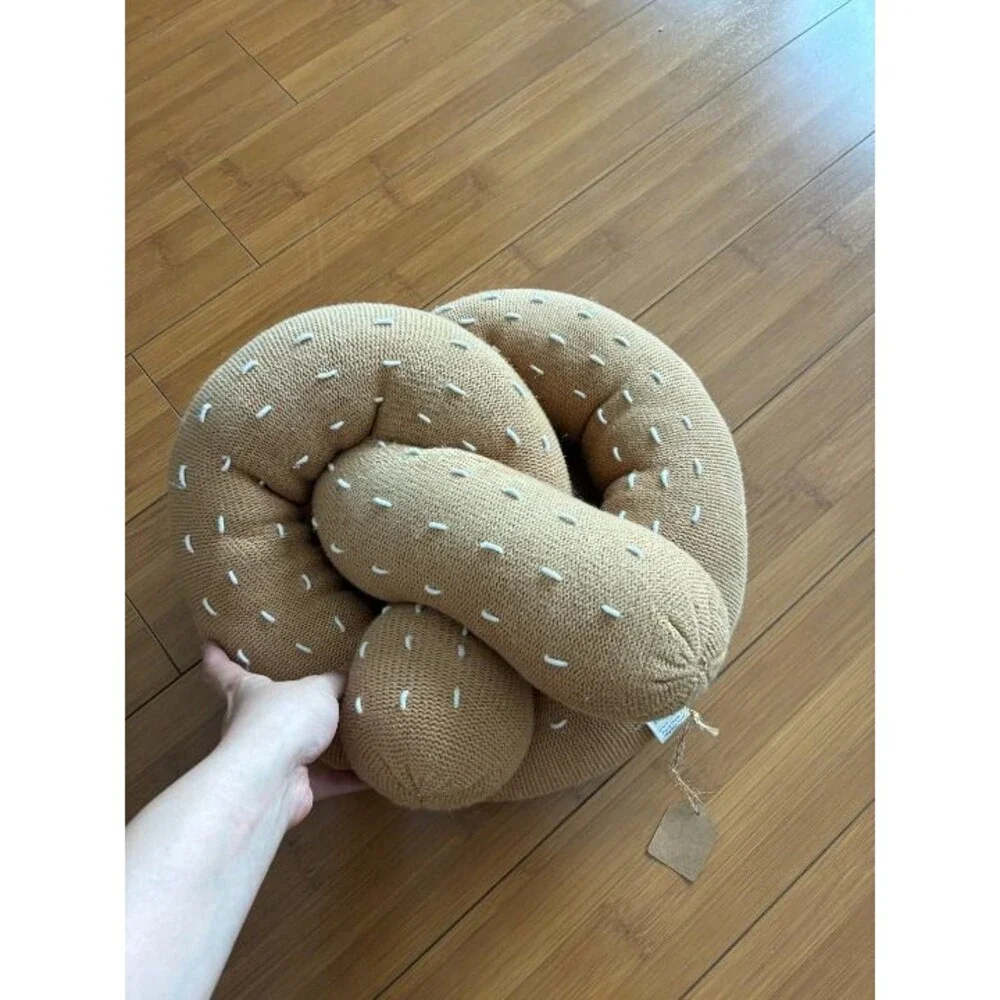 Large Estella hand-knitted organic cotton pretzel pillow